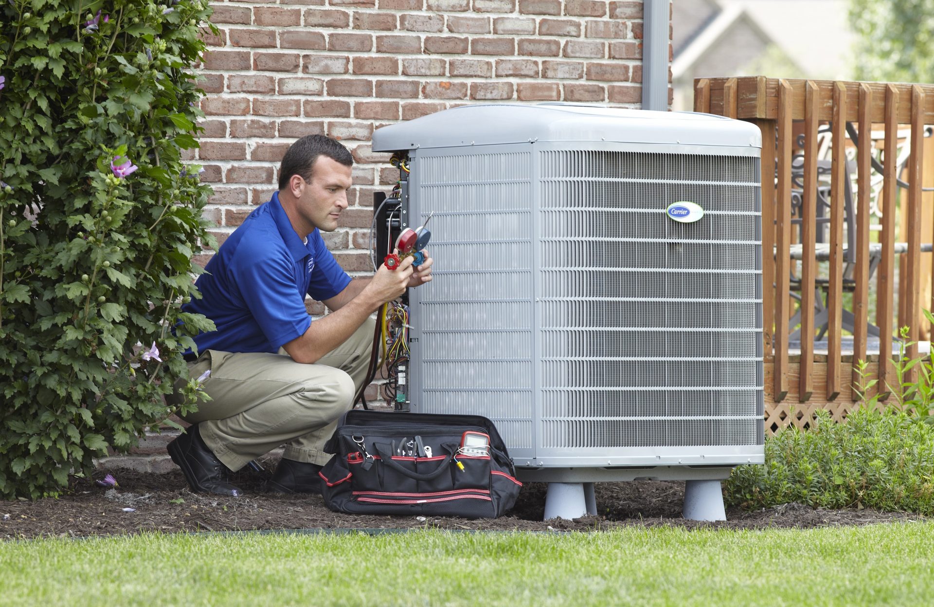 HVAC repairman fixes faulty carrier brand air conditioning condenser in Livermore, California