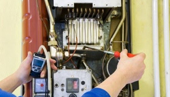 heating technician in Dublin, CA tests a malfunctioning gas furnace
