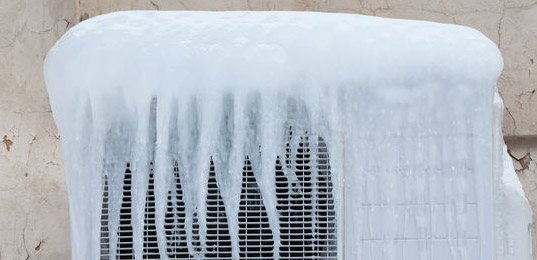 ac unit covered with ice