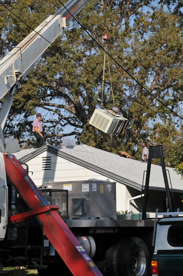 Installing a new air conditioner with the help of a crane in Dublin, California
