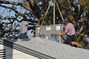 Bradford Air & Heating team installs a rooftop HVAC unit