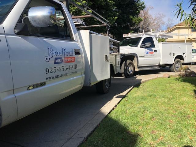 Bradford Air and Heating car on site for an AC installation in Alamo